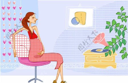 怀孕的居家女人听唱片图片