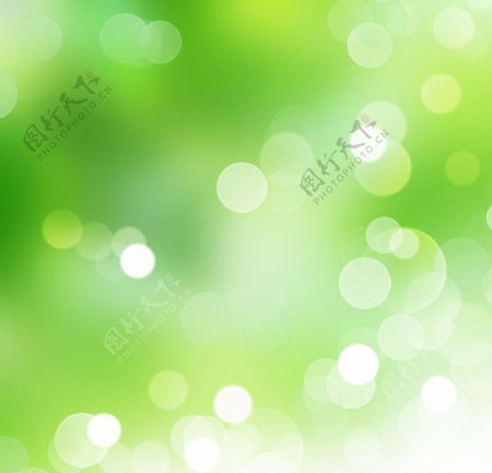 绿色背景上闪烁的光斑图片