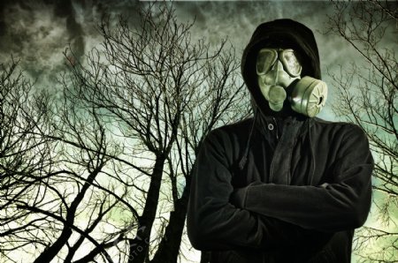 空气污染与戴防毒面具的男人图片