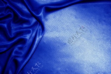 蓝色丝绸质感光滑素材背景图片