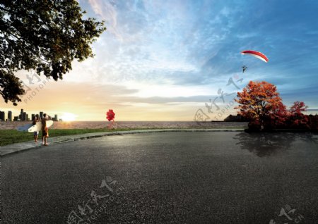 海滩跳伞夕阳图片