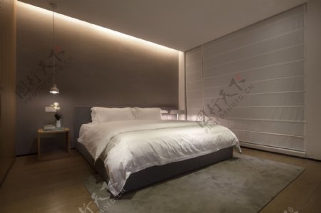 现代简约卧室浅褐色背景墙室内装修效果图